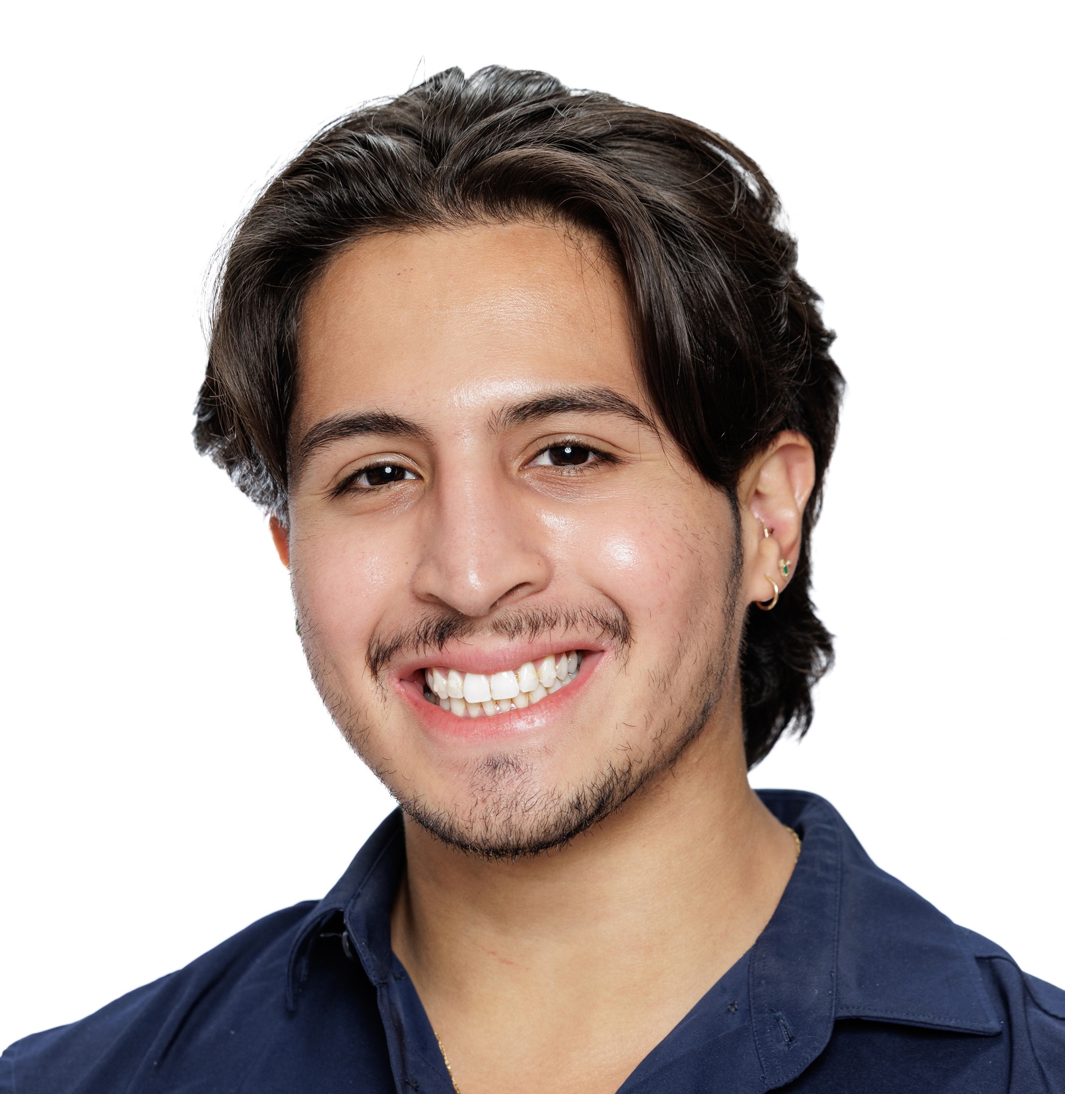 A photo of team member Brandon standing in the woods.