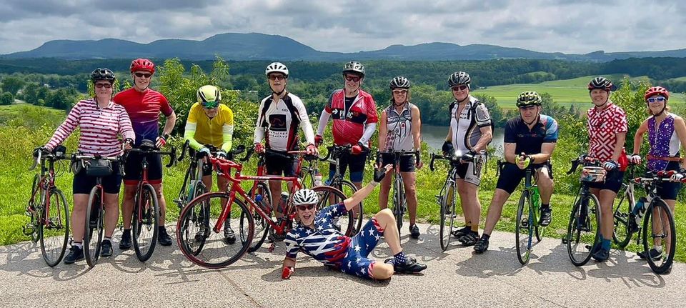 Biking community hanging out in a park.